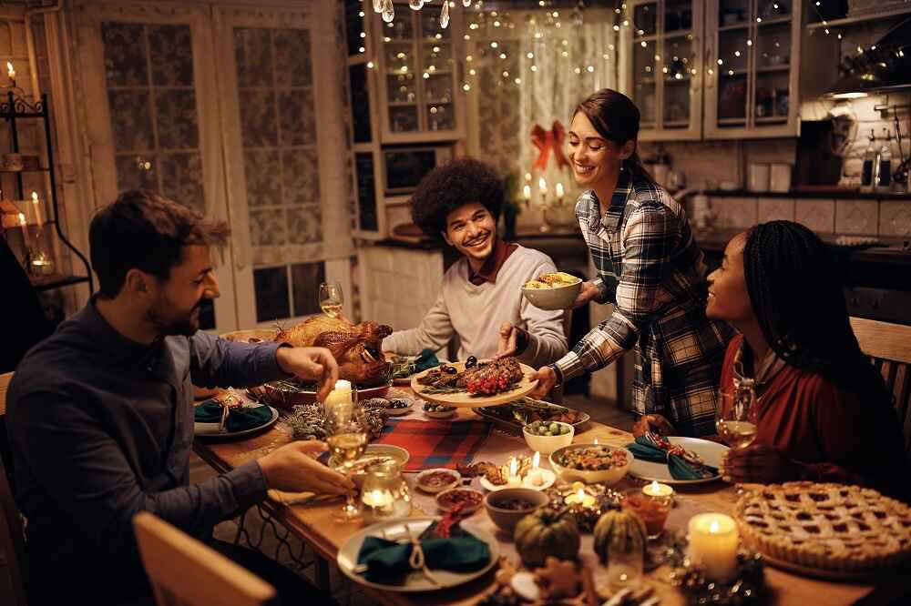 group of people at dinner table during Christmas