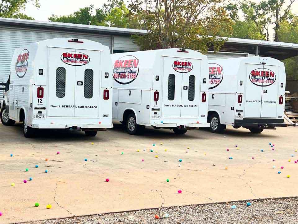 Skeen service van parked in front of a house
